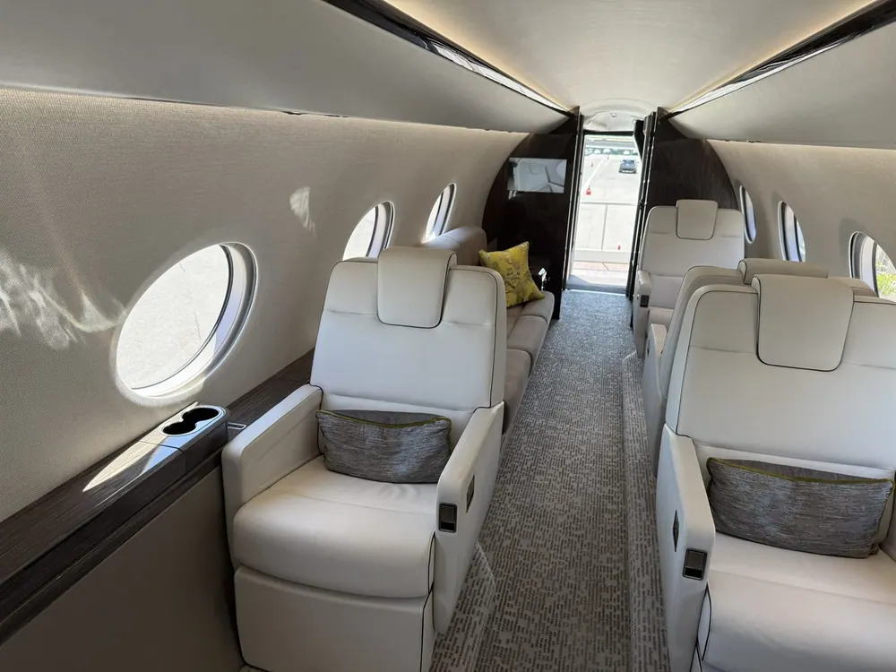 Private jet cabin with facing seats