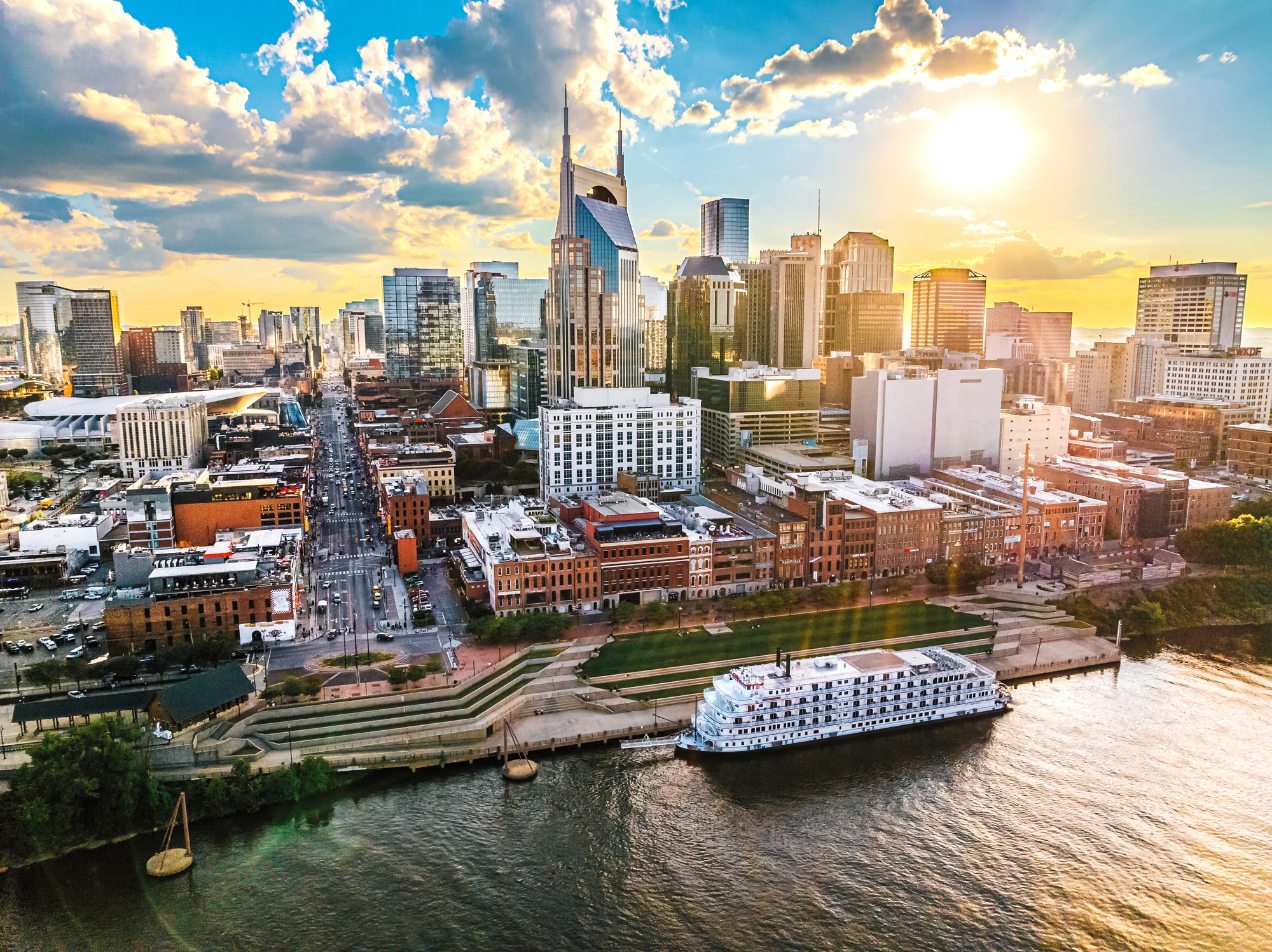 Nashville skyline and riverfront in golden evening light